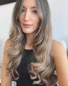 Blonde balayage hair colour modelled by woman